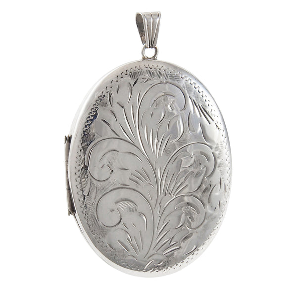 A modern, silver, engraved, oval locket