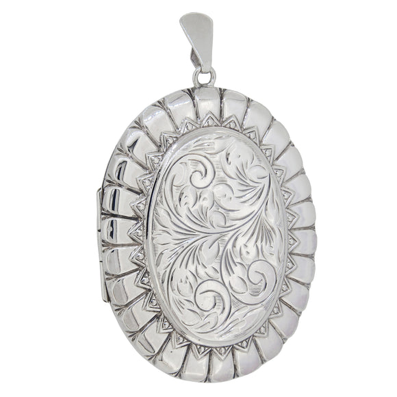 A modern, silver, engraved oval locket