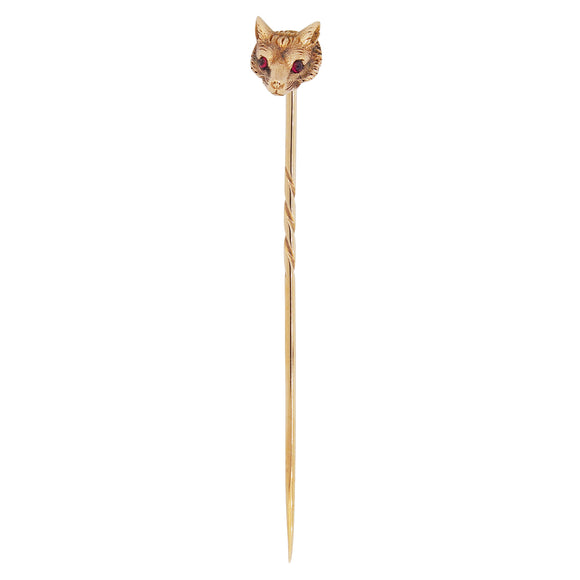 An early 20th century, yellow gold, garnet set fox stick pin.