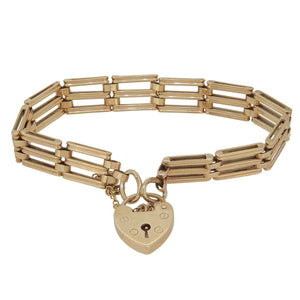 A modern, 9ct yellow gold, gate link bracelet with a padlock clasp.