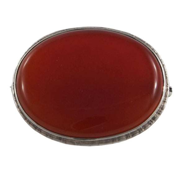 A silver, oval, brown carnelian set brooch