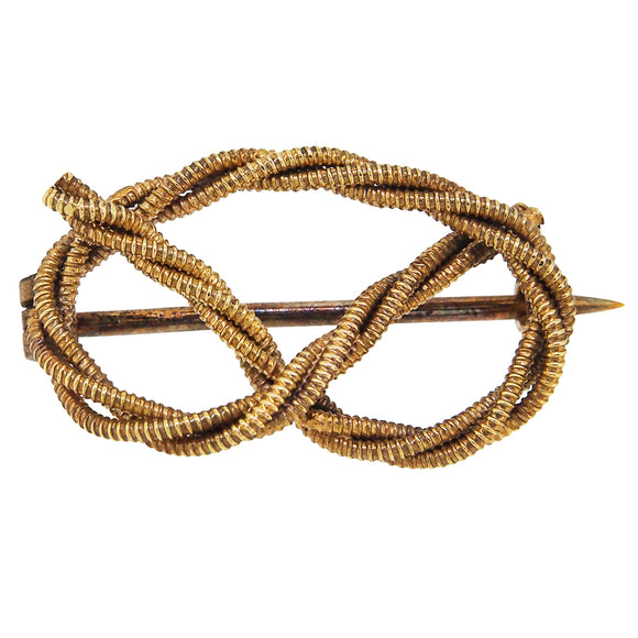 A mid-20th century, 9ct yellow gold, cord twist knot brooch