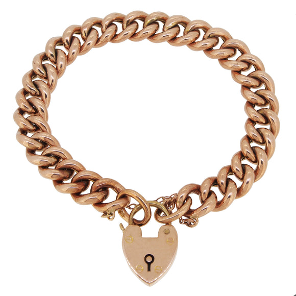 An early 20th century, 9ct rose gold, hollow curb link padlock bracelet