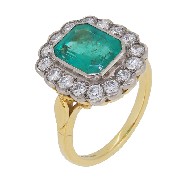 An 18ct yellow gold, emerald & diamond set cluster ring