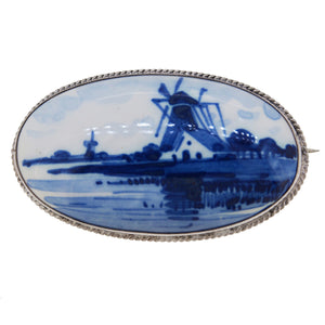 A mid-20th century, silver, Delftware Brooch, featuring an image of a windmill