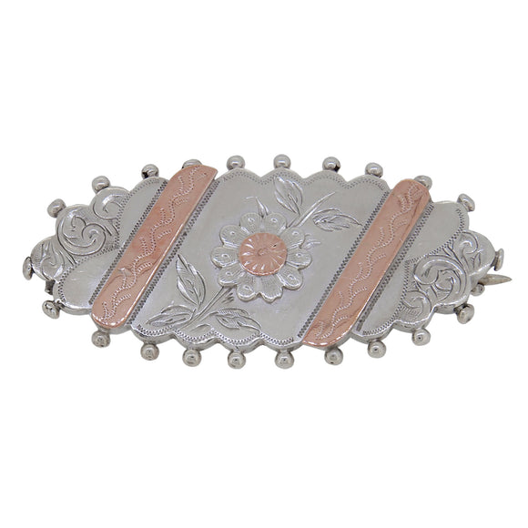 A Victorian, silver & applied gold, flower & scroll brooch