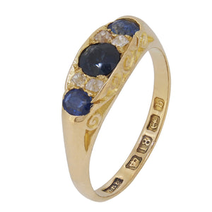 An Edwardian, 18ct yellow gold, sapphire & diamond set, boat shaped, seven stone ring