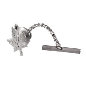 A modern, silver, maple leaf tie tack