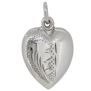 A mid-20th century, half engraved, heart shaped pendant