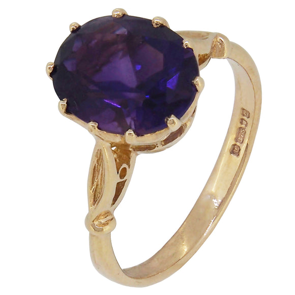 A modern, 9ct yellow gold, amethyst set, single stone ring