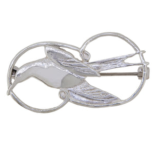 A modern, silver swift brooch