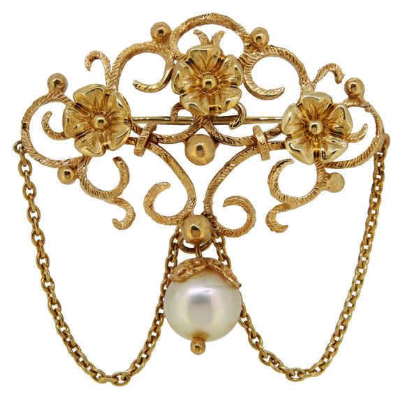 A modern, 14ct yellow gold, pearl set, open scroll, floral brooch