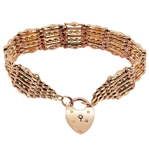 An early 20th century, 9ct rose gold, gate link padlock bracelet