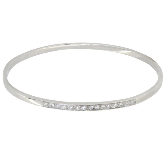 A modern, 18ct white gold, diamond set bangle