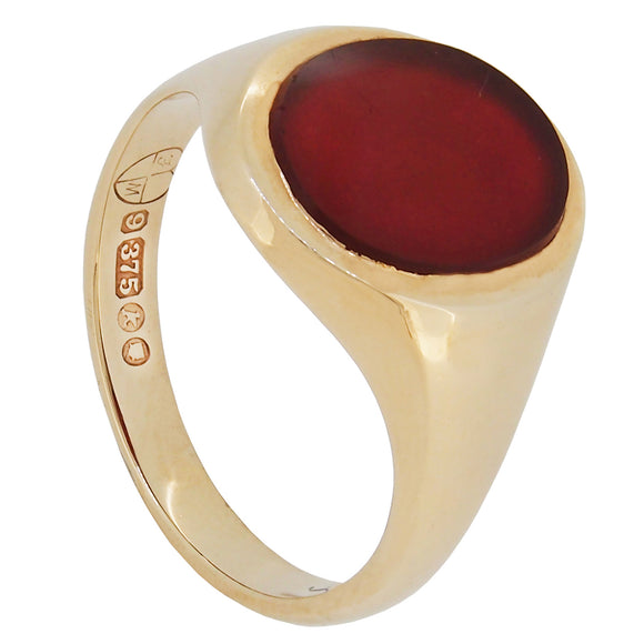 A mid-20th century, 9ct yellow gold, brown carnelian set, single stone, oval signet ring