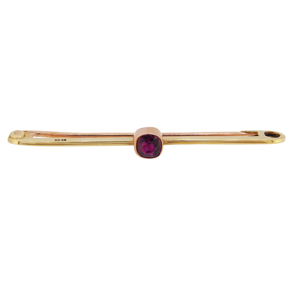 An early 20th century, 15ct yellow gold, ruby set bar brooch