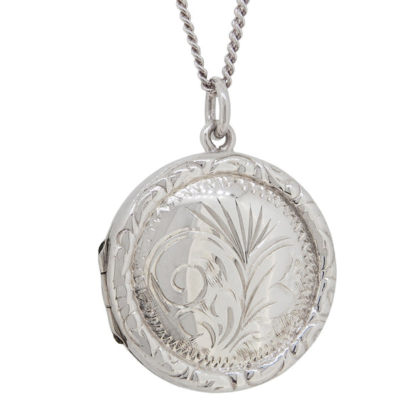 A modern, silver, engraved, circular locket & chain