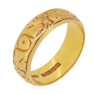 A mid-20th century, 22ct yellow gold, chased D shaped wedding ring