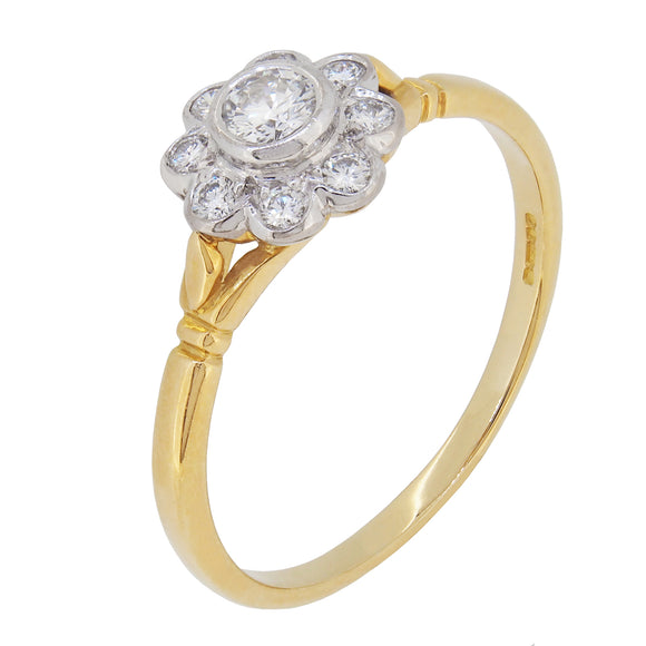 A modern, 18ct yellow & white gold, diamond set cluster ring