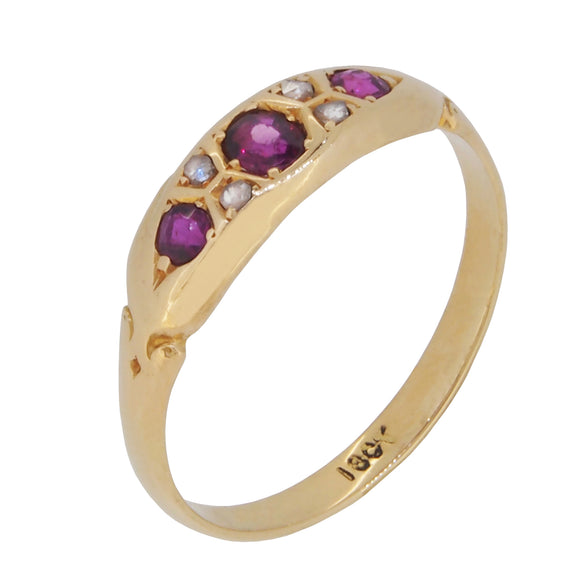 An early 20th century, 18ct yellow gold, ruby & diamond gypsy set, seven stone ring.