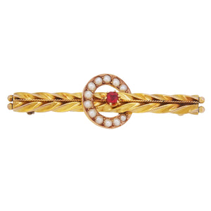 An early 20th century, 9ct yellow gold, pearl & red gem set bar brooch