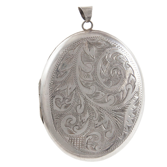 A modern, silver, engraved oval locket