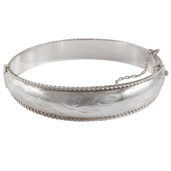 A modern, silver, plain, hinged bangle with a rope edge