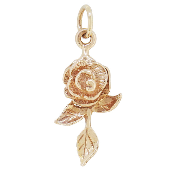 A mid-20th century, yellow gold flower charm