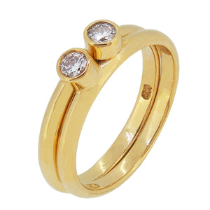 A pair of modern, 18ct yellow gold, diamond set, single stone interlocking rings