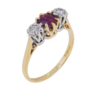 A modern, 18ct yellow gold, ruby & diamond set, three stone ring