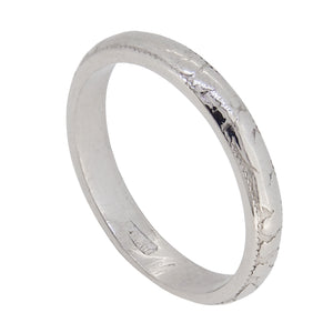 An early 20th century, platinum, engraved court wedding ring