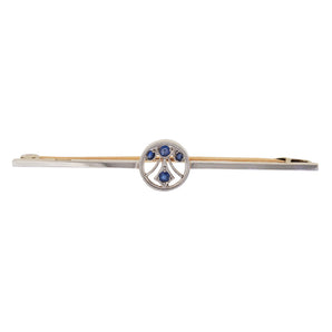 A modern, platinum, sapphire set bar brooch with a 15ct yellow gold pin.