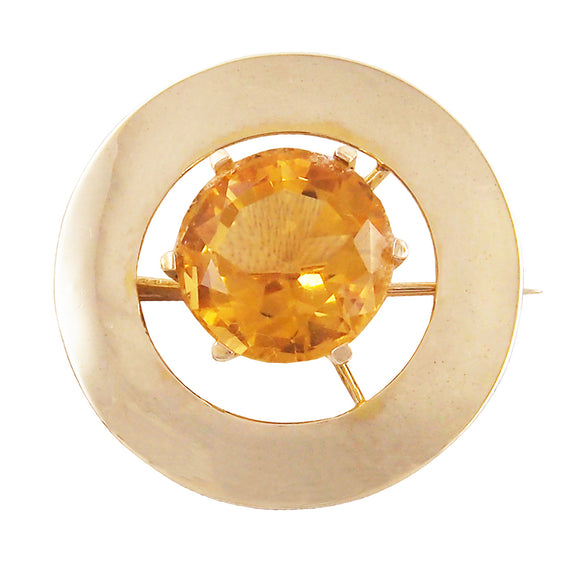 A modern, yellow gold, citrine set circular brooch