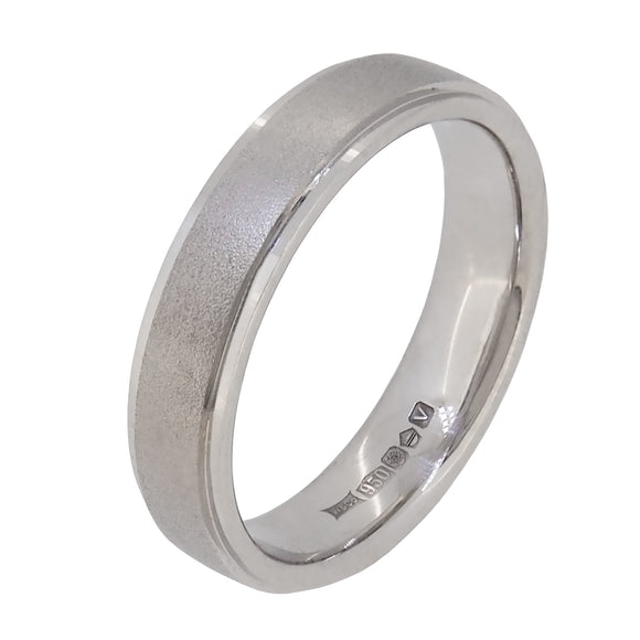 A modern, platinum, flat, textured wedding ring