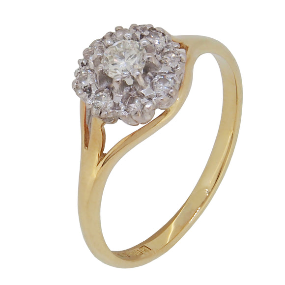 A modern, 18ct yellow gold, diamond set cluster ring