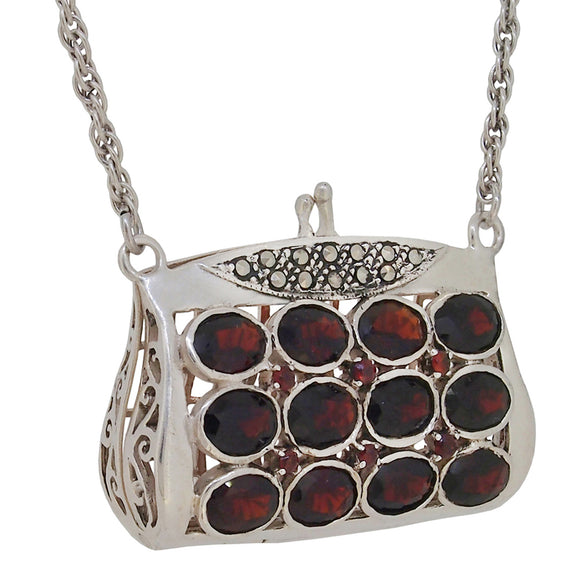 A modern, silver, garnet & marcasite set purse necklace