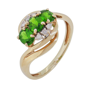 A modern, 9ct yellow gold, green diopside & diamond set, nine stone crossover ring