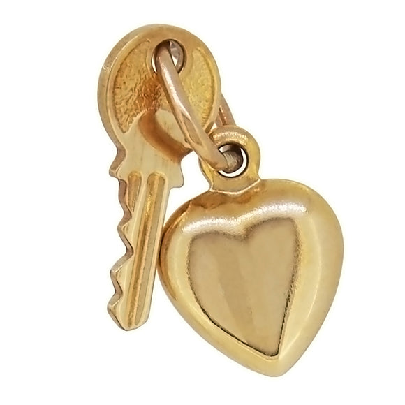 A mid-20th century, 9ct yellow gold, key & heart charm