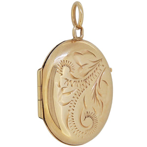 A mid-20th century, 9ct yellow gold, fully engraved oval locket
