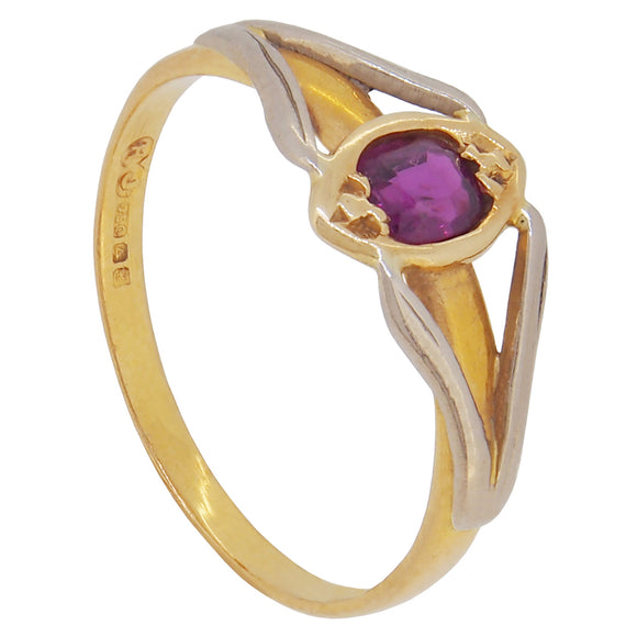 A modern 18ct yellow & white gold, ruby set, single stone ring