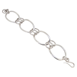 A modern, silver, oval link bracelet