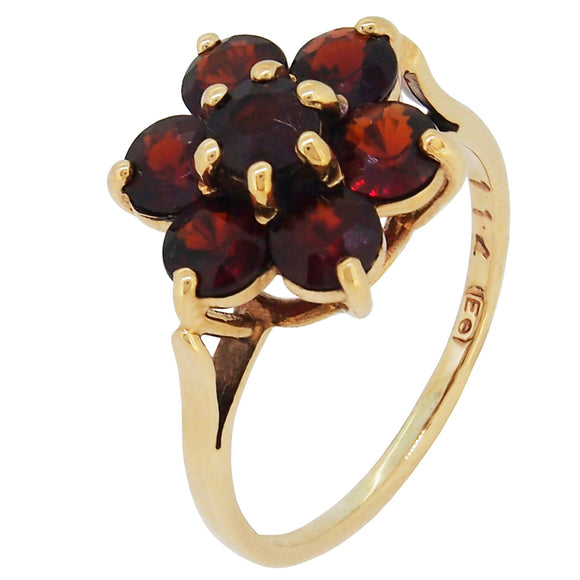 A modern, 9ct yellow gold, garnet set cluster ring