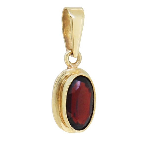 A modern, 14ct yellow gold, garnet set pendant