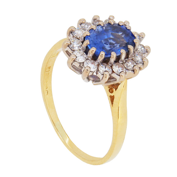 A modern, 18ct yellow gold, sapphire & diamond set cluster ring.