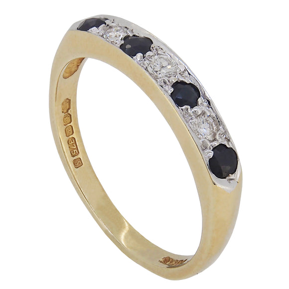 A modern, 9ct yellow gold, sapphire & diamond set, seven stone half eternity ring