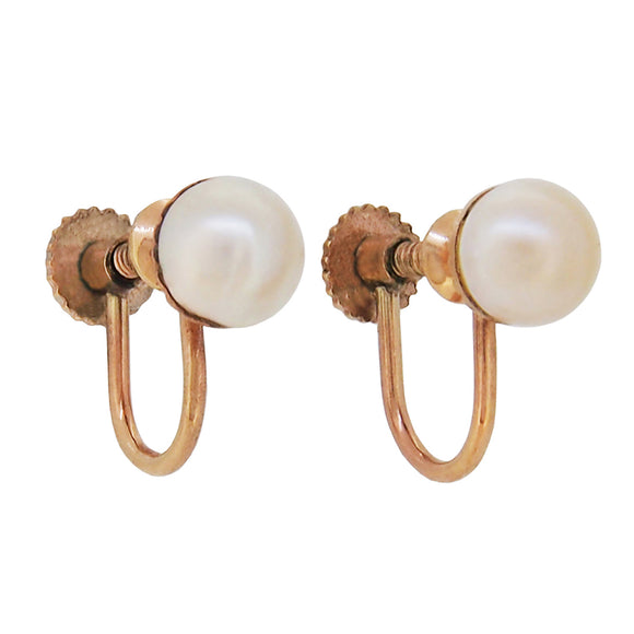 A pair of mid 20th century, 9ct yellow gold, pearl set screw on earrings