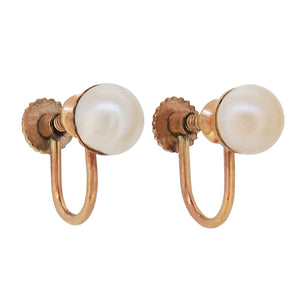 A pair of mid 20th century, 9ct yellow gold, pearl set screw on earrings.