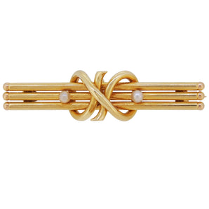 An early 20th century, 15ct yellow gold, pearl set, two stone, three bar brooch