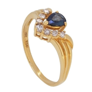 A modern, 18ct yellow gold, pear cut sapphire & diamond set, eight stone, V shaped ring