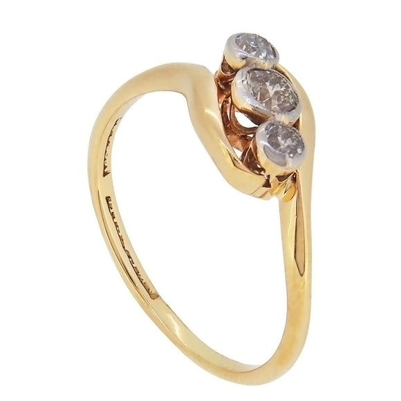 An early 20th century, 18ct yellow gold & platinum setting, diamond set, three stone crossover ring